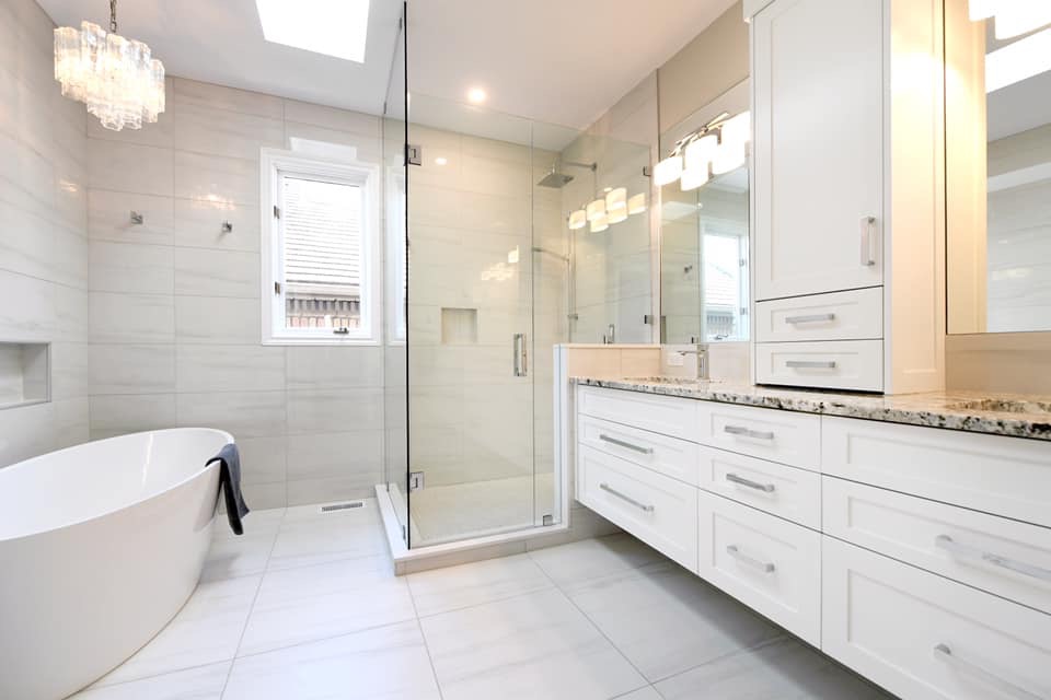 Master bathroom with freestanding tub and large format tile