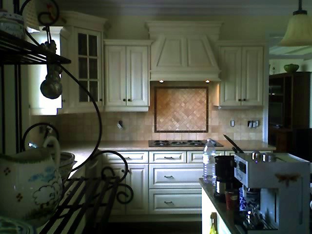 Herringbone stone kitchen backsplash